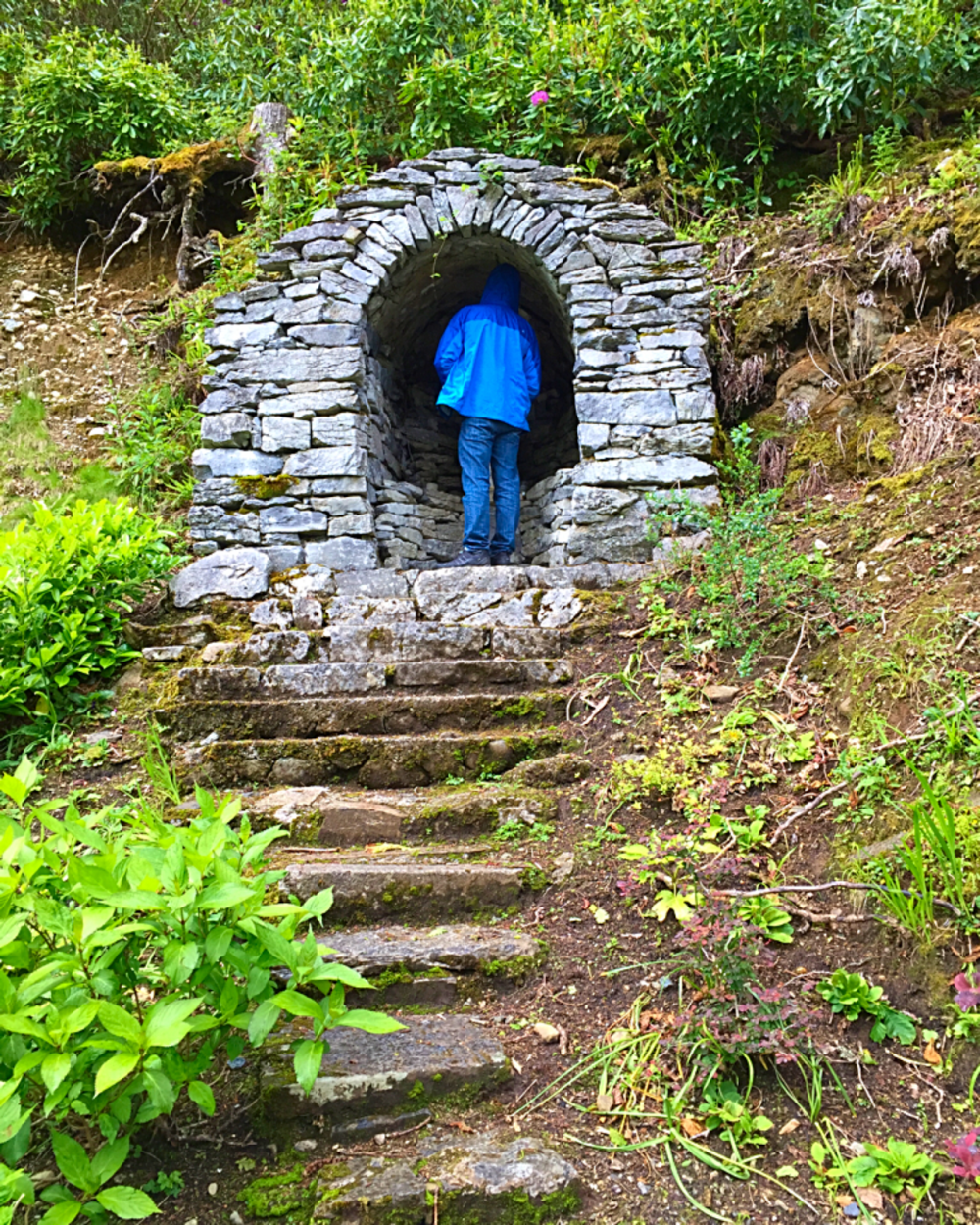 Walking up to the small shrine in the hill at Kylemore Abbey, County Galway.