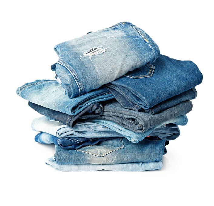 A huge pile of like nine pairs of jeans.