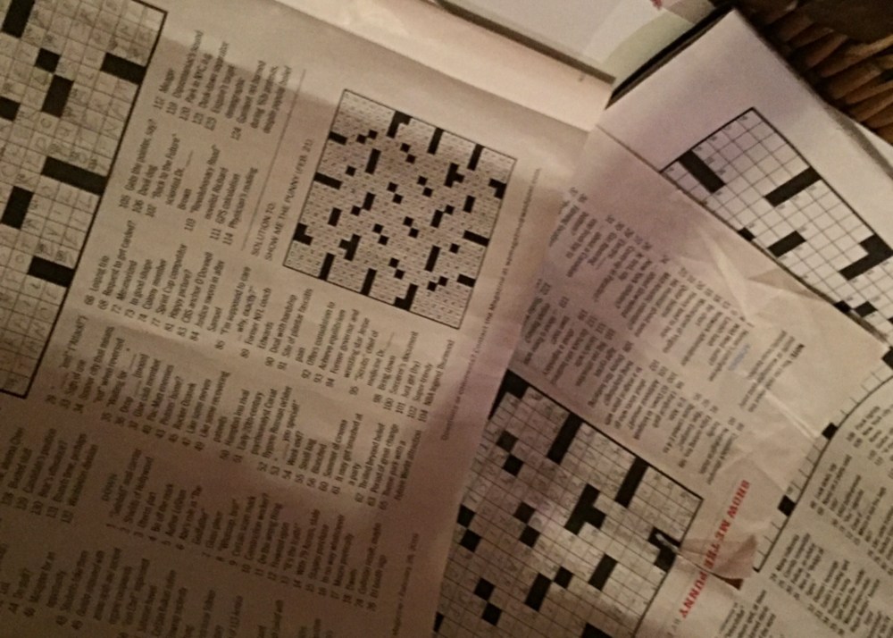 Pile of old crosswords in the Sunday Magazine appropriately piled in the recycling basket. 