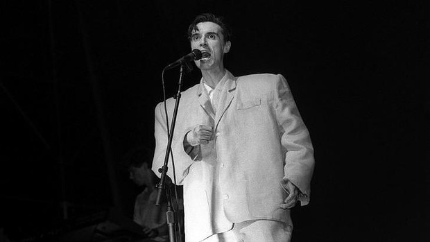 David Byrne from Talking Heads in a very ill-fitting and white suit.