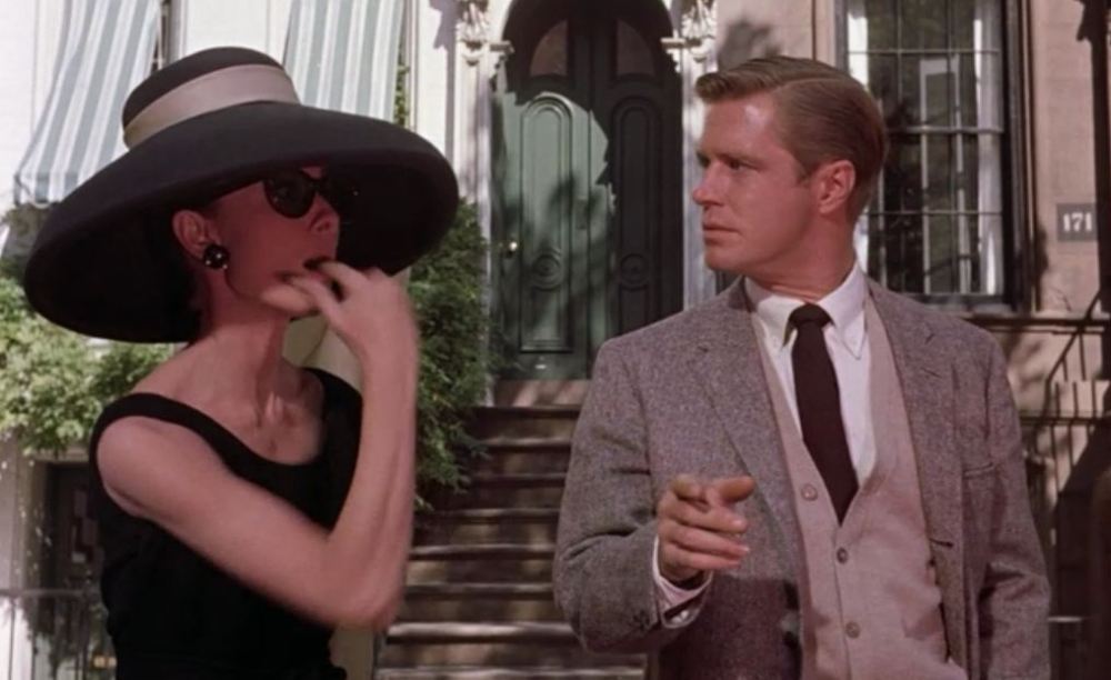 Holly Golightly whistling for a cab. She surprised what's his name.