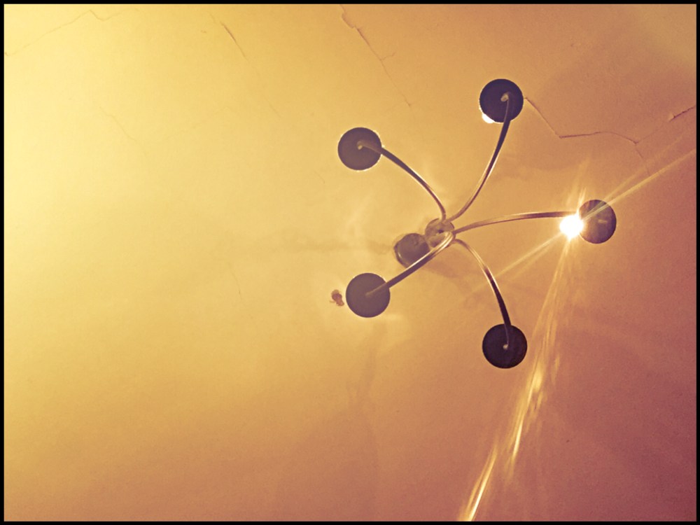 Look up. At the light. From the ceiling.