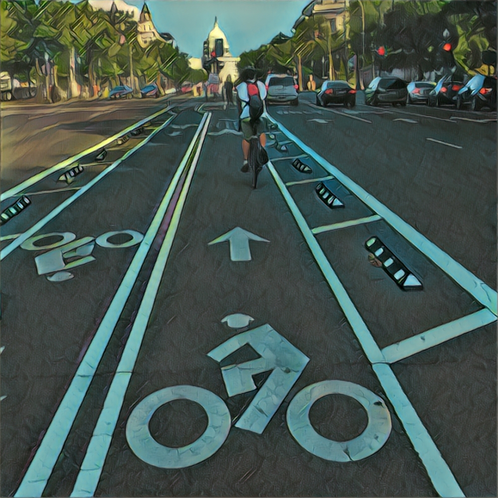 RIding a bike down Pennsylvania Ave with the Capitol ahead.