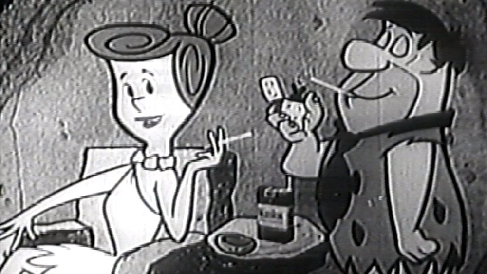 Wilma and Fred smoking.