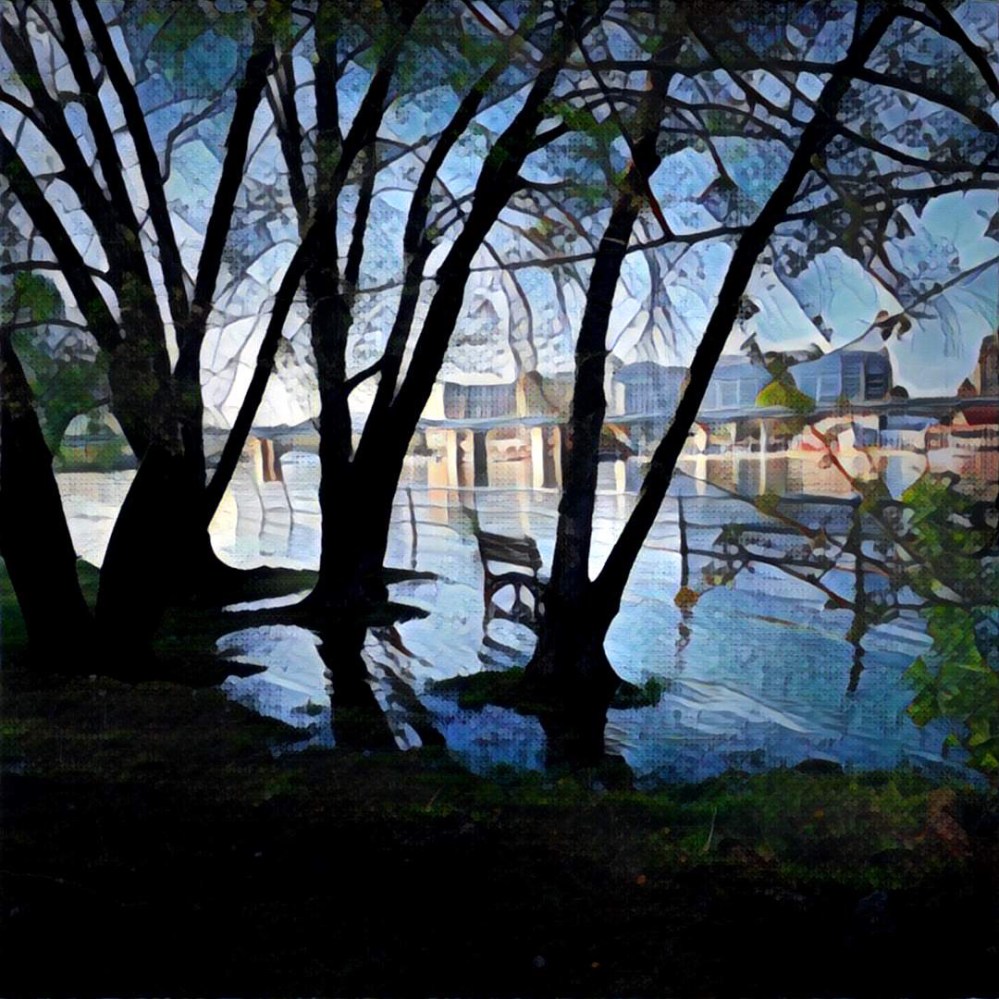 The Potomac River breaching the park to the bench.