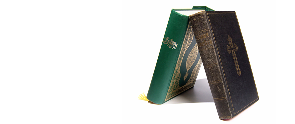 Two books of religious teachings, the Quran and the Bible.