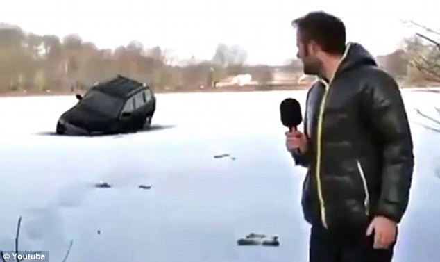 The moment the SUV plunges into the thin ice on the mostly frozen lake. As captured on the local news.