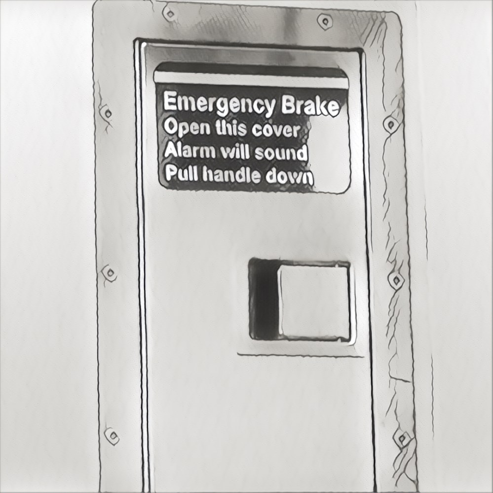 From the AMTRAK: Emergency Brake. Open this cover. Alarm will sound. Pull handle down.