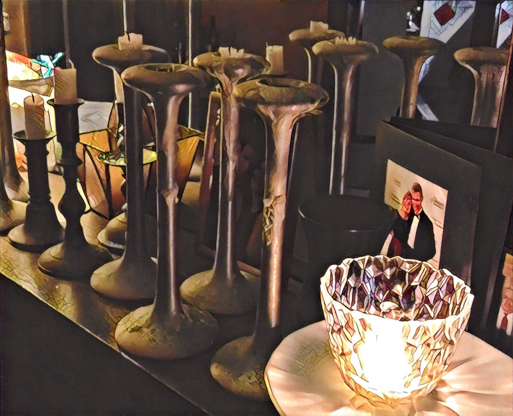 The 100 year old mantle peppered with candlesticks and pictures. I guess it's in the East Wing.