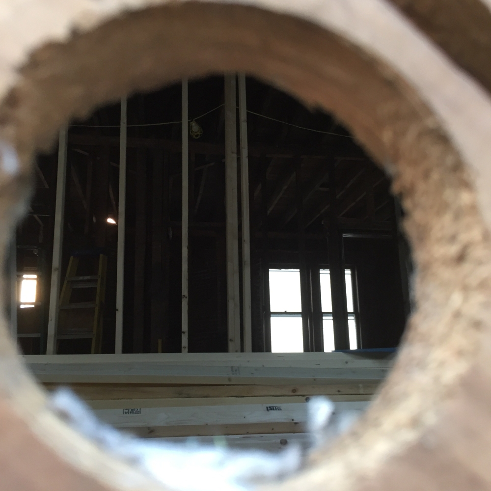 Looking through a hole in the wall to the other side of the house.