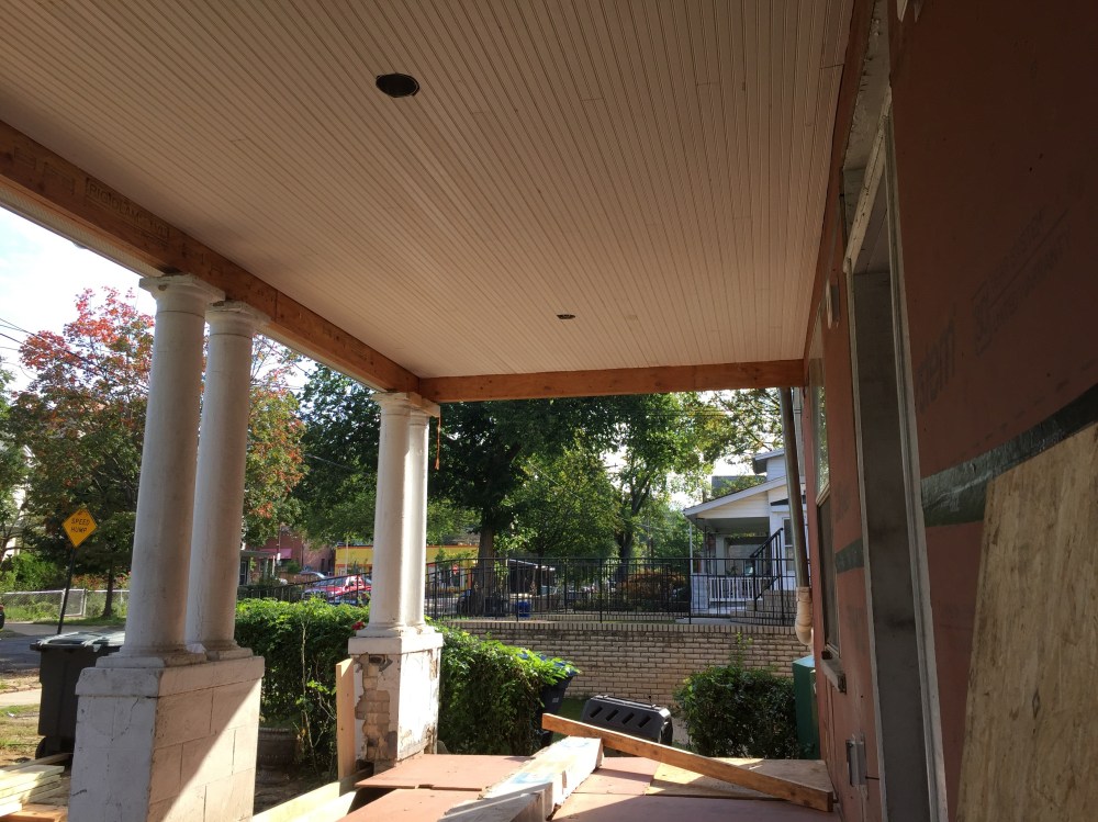 The new headboard ceiling on the porch. See also where the new fixtures--a pair of fans!--will go.